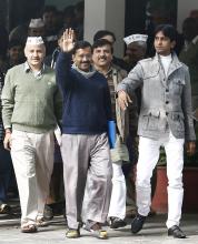 Arvind Kejriwal (C), leader of the newly formed Aam Aadmi (Common Man) Party (AAP), waves after his meeting with the Delhi's Lieutenant Governor Najeeb Jung in New Delhi
