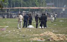 Indian National Security Guard (NSG) commandos inspect the site of a bomb blast in the eastern Indian city of Patna