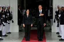 Taiwan's President Tsai Ing-wen listens with her counterpart Panama's Juan Carlos Varela to the national anthem during a welcome ceremony before a meeting at the Presidential Palace in Panama City, Panama, June 27, 2016. PHOTO BY REUTERS/Carlos Jasso