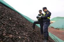 Chinese customs officers inspect solid waste seized in their operations against smuggled foreign waste, in Rizhao, Shandong province, China, November 15, 2018. PHOTO BY REUTERS/Stringer