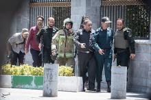 Members of Iranian forces are seen during an attack on the Iranian parliament in central Tehran, Iran, June 7, 2017. PHOTO BY REUTERS/Tasnim News Agency