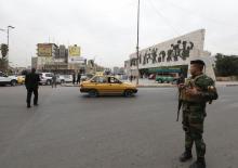 As Baghdad lifts curfew, bombs are reminder of country at war
