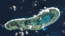 and can be seen spilling from a newly dredged channel in this view of Vietnamese-held Ladd Reef, in the Spratly Island group in the South China Sea, November 30, 2016. PHOTO BY REUTERS/Trevor Hammond