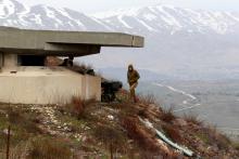 An Israeli soldier walks near a military post close to the Druze village of Majdal Shams in the Israeli-occupied Golan Heights, Israel, February 10, 2018. PHOTO BY REUTERS/Ammar Awad