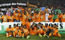 Ivory Coast's players celebrate with the trophy after winning the African Nations Cup final soccer match against Ghana in Bata, February 8, 2015. PHOTO BY REUTERS/Amr Abdallah Dalsh