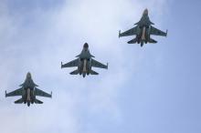 Russian military jets flying from Syria shortly before landing on the runway of an airbase in Buturlinovka in Voronezh region, Russia, March 15, 2016. PHOTO BY REUTERS/Olga Balashova