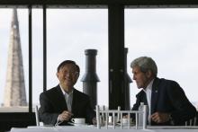 China's State Councillor Yang Jiechi (L) and U.S. Secretary of State John Kerry talk over tea during a day of meetings in Boston, Massachusetts