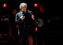 Singer Bob Dylan performs during a segment honoring Director Martin Scorsese, recipient of the Music+ Film Award, at the 17th Annual Critics' Choice Movie Awards in Los Angeles, January 12, 2012. PHOTO BY REUTERS/Mario Anzuoni