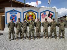U.S. commander General for Afghanistan, John Nicholson (4th L) poses for pictures at forward operating base Gamberi, Laghman province, April 4, 2016. PHOTO BY REUTERS/Paul Tait