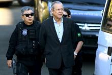 Jose Dirceu (front R), former Brazilian President Luiz Inacio Lula da Silva's chief of staff, is escorted by federal police officer Newton Ishii as he leaves the Federal Police headquarters to give his testimony in a session of the Parliamentary Committee of Inquiry in Curitiba, Brazil, August 31, 2015. PHOTO BY REUTERS/Rodolfo Buhrer