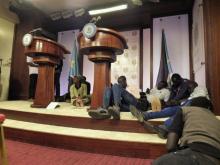 Journalists are seen on the podium following sounds of gun shots before a news conference inside the Presidential State House in Juba, South Sudan, July 8, 2016. PHOTO BY REUTERS/Stringer
