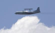 A KJ-200 surveillance aircraft of the Chinese Air Force flies during a training session for the upcoming parade marking the 70th anniversary of the end of World War Two, on the outskirts of Beijing, July 2, 2015. PHOTO BY REUTERS/Jason Lee