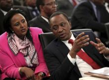 Kenyan President Uhuru Kenyatta (R) chats with his Foreign Minister Amina Mohamed