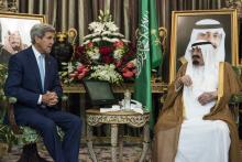 Saudi King Abdullah bin Abdul Aziz al-Saud (R) talks with U.S. Secretary of State John Kerry before a meeting at the Royal Palace in Jeddah, September 11, 2014. PHOTO BY REUTERS/Brendan Smialowski