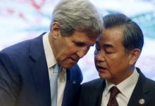 U.S. Secretary of State John Kerry and China's Foreign Minister Wang Yi talk at the 5th East Asia Summmit at the 48th Association of Southeast Asian Nations (ASEAN) foreign ministers meeting in Kuala Lumpur, Malaysia, August 6, 2015. PHOTO BY REUTERS/Olivia Harris