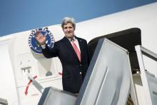 U.S. Secretary of State John Kerry waves as he boards his plane at Ben Gurion International Airport in Tel Aviv