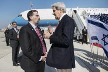 U.S. Secretary of State John Kerry (R) speaks with U.S. Ambassador to Israel Daniel Shapiro at Ben Gurion International Airport in Tel Aviv