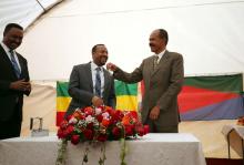 Eritrea's President, Isaias Afwerki receives a key from Ethiopia's Prime Minister, Abiy Ahmed during the Inauguration ceremony marking the reopening of the Eritrean Embassy in Addis Ababa, Ethiopia, July 16, 2018. PHOTO BY REUTERS/Tiksa Negeri