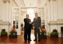 North Korea's leader Kim Jong Un shakes hands with Singapore's Prime Minister Lee Hsien Loong at the Istana in Singapore, June 10, 2018. PHOTO BY REUTERS/Edgar Su