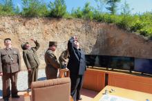 Kim Jong Un looks on during the test-launch of the intercontinental ballistic missile Hwasong-14, in this photo released July 5, 2017. PHOTO BY REUTERS/KCNA