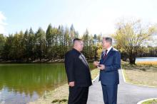 North Korean leader Kim Jong Un and South Korean President Moon Jae-in talk while taking a walk at Samjiyon Guesthouse in Ryanggang province, North Korea, September 20, 2018. PHOTO BY REUTERS/Pyeongyang Press Corps