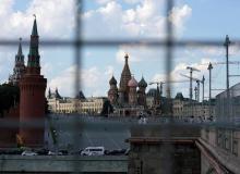 A view through a construction fence shows the Kremlin towers and St. Basil's Cathedral on a hot summer day in central Moscow, Russia, July 1, 2016. PHOTO BY REUTERS/Maxim Zmeyev