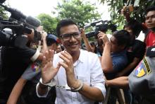 Kyaw Zaw Linn, the editor in charge at Eleven Media arrives after being detained at Tamwe court in Yangon, Myanmar, October 10, 2018. PHOTO BY REUTERS/Ann Wang