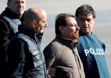 Former Italian leftist guerrilla Cesare Battisti is escorted by police from Ciampino airport in Rome, Italy, January 14, 2019. PHOTO BY REUTERS/Max Rossi