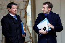 French Prime Minister Manuel Valls (L) and Economy Minister Emmanuel Macron (R) leave the Elysee palace in Paris, France, following the weekly cabinet meeting, March 9, 2016. photo by REUTERS/Philippe Wojazer