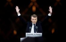 French President-elect Emmanuel Macron celebrates on the stage at his victory rally near the Louvre in Paris, France, May 7, 2017. PHOTO BY REUTERS/Christian Hartmann