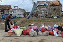 A men takes out his belongings from his damaged house after a tornado hit Funing on Thursday, in Yancheng, Jiangsu province, June 24, 2016. PHOTO BY REUTERS/Stringer