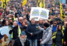 Flemish right-wing party President Filip Dewinter attends a protest against Marrakesh Migration Pact in Brussels, Belgium, December 16, 2018. Banner reads "People first". PHOTO BY REUTERS/Francois Lenoir
