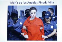 Maria de los Angeles Pineda Villa, the wife of former mayor of Iguala, Jose Luis Abarca, is seen displayed on a television screen during a news conference, while she is transferred to a prison in Tepic, at Nayarit state, in Mexico City, January 5, 2015. PHOTO BY REUTERS/Mexico's Attorney General's Office