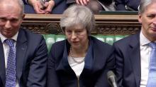 Prime Minister Theresa May sits down in Parliament after the vote on May's Brexit deal, in London, Britain, January 15, 2019 in this screengrab taken from video. PHOTO BY REUTERS/Reuters TV