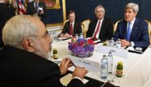 Iran's Foreign Minister Javad Zarif (L) holds a bilateral meeting with U.S. Secretary of State John Kerry (R) on the second straight day of talks over Tehran's nuclear program in Vienna