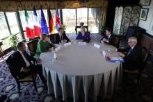 French President Emmanuel Macron speaks as L-R: European Council President Donald Tusk, German Chancellor Angela Merkel, Macron, British Prime Minister Theresa May, Italian Prime Minister Giuseppe Conte and European Commission President Jean-Claude Juncker meet at the G7 Summit in the Charlevoix city of La Malbaie, Quebec, Canada, June 8, 2018. PHOTO BY REUTERS/Yves Herman