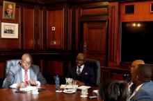 South Africa's new finance minister, Malusi Gigaba (2nd R) speaks with members of the treasury during his visit to their offices in Pretoria, South Africa, March 31,2017. PHOTO BY REUTERS/Siphiwe Sibeko