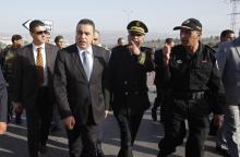 Tunisia's Prime Minister Mehdi Jomaa (front, in blue tie) inspects Tunisian police standing guard on the eve of presidential elections, in Beja, November 22, 2014. PHOTO BY REUTERS/Zoubeir Souissi