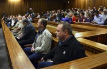 Members of the right-wing "Boeremag" wait ahead of their sentencing at Pretoria High Court