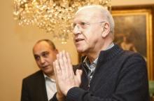 Former Lebanese Information Minister Michel Samaha gestures at his house after being released in Beirut, Lebanon, January 14, 2016. PHOTO BY REUTERS/Mohamed Azakir