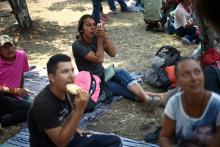 Central American migrants, moving in a caravan through Mexico toward the U.S. border, rest and eat at a shelter set up for them by the Catholic church, in Puebla, Mexico, April 6, 2018. PHOTO BY REUTERS/Edgard Garrido