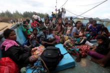 Sri Lankan immigrants are pictured on their boat after being stranded at Pulo Kapuk beach in Lhoknga, Aceh province, Indonesia, June 14, 2016. PHOTO BY REUTERS/Irwansyah Putra