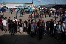 Migrants, part of a caravan of thousands from Central America trying to reach the United States, line up in a temporary shelter in Tijuana, Mexico, December 2, 2018. PHOTO BY REUTERS/Alkis Konstantinidis