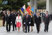 U.S. Vice President Mike Pence, center, and his wife Karen, center left, inspect hour guard upon their arrival at the National Cemetery in Seoul, South Korea, Sunday, April. 16, 2017. PHOTO BY REUTERS/Ahn Young-joon