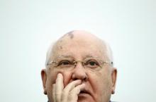 Former Soviet President Mikhail Gorbachev addresses students as he visits the International University in Moscow
