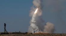 An S-300 air defense missile system launches a missile during the Keys to the Sky competition at the International Army Games 2017 at the Ashuluk shooting range outside Astrakhan, Russia, August 5, 2017. PHOTO BY REUTERS/Maxim Shemetov