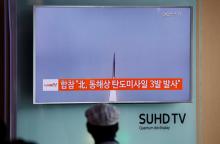A passenger watches a TV screen broadcasting a news report on North Korea firing three ballistic missiles into the sea off its east coast, at a railway station in Seoul, South Korea, September 5, 2016. PHOTO BY REUTERS/Kim Hong-Ji