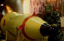 A member of the Iranian Revolutionary Guards checks a missile inside an underground depot in an undisclosed location, Iran, in this handout photo released by the official website of Islamic Revolutionary Guard Corps (IRGC) on March 8, 2016. PHOTO BY REUTERS/sepahnews.com