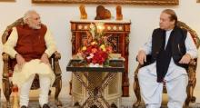 Pakistani Prime Minister Nawaz Sharif (R) talks with his Indian counterpart Narendra Modi in Lahore, Pakistan, December 25, 2015. PHOTO BY REUTERS/Press Information Department (PID)