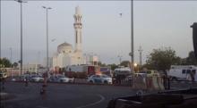 General view of security personnel in front of a mosque as police stage a second controlled explosion, after a suicide bomber was killed and two other people wounded in a blast near the U.S. consulate in Jeddah, Saudi Arabia, in this still frame taken from video July 4, 2016. PHOTO BY REUTERS